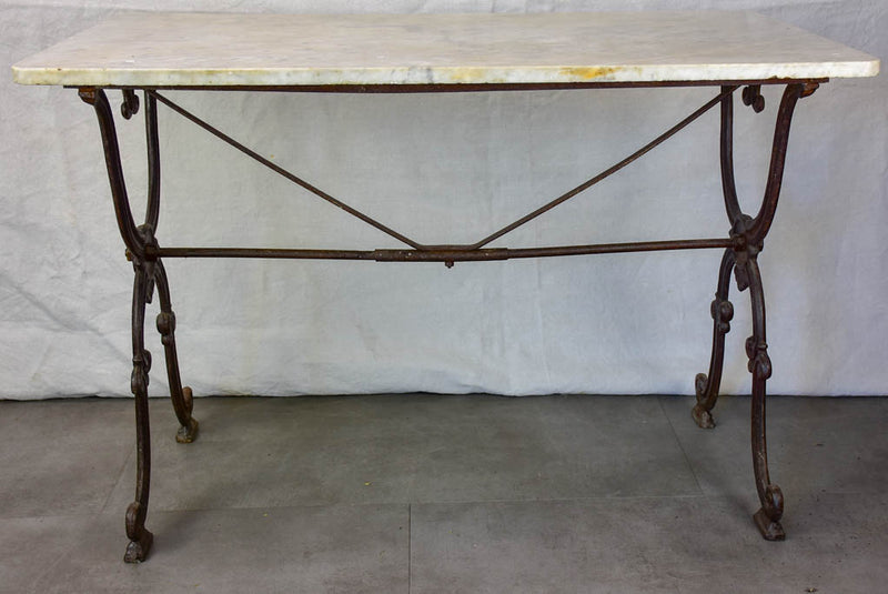Late nineteenth century French marble presentation table with cast iron base 23¾" x  40½"