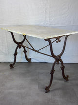 Late nineteenth century French marble presentation table with cast iron base 23¾" x  40½"