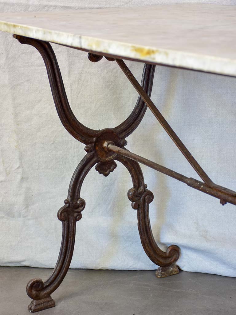 Late nineteenth century French marble presentation table with cast iron base 23¾" x  40½"