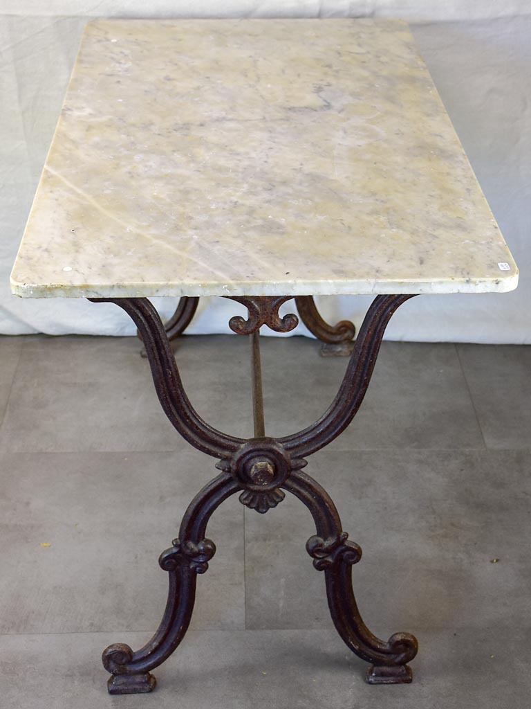 Late nineteenth century French marble presentation table with cast iron base 23¾" x  40½"