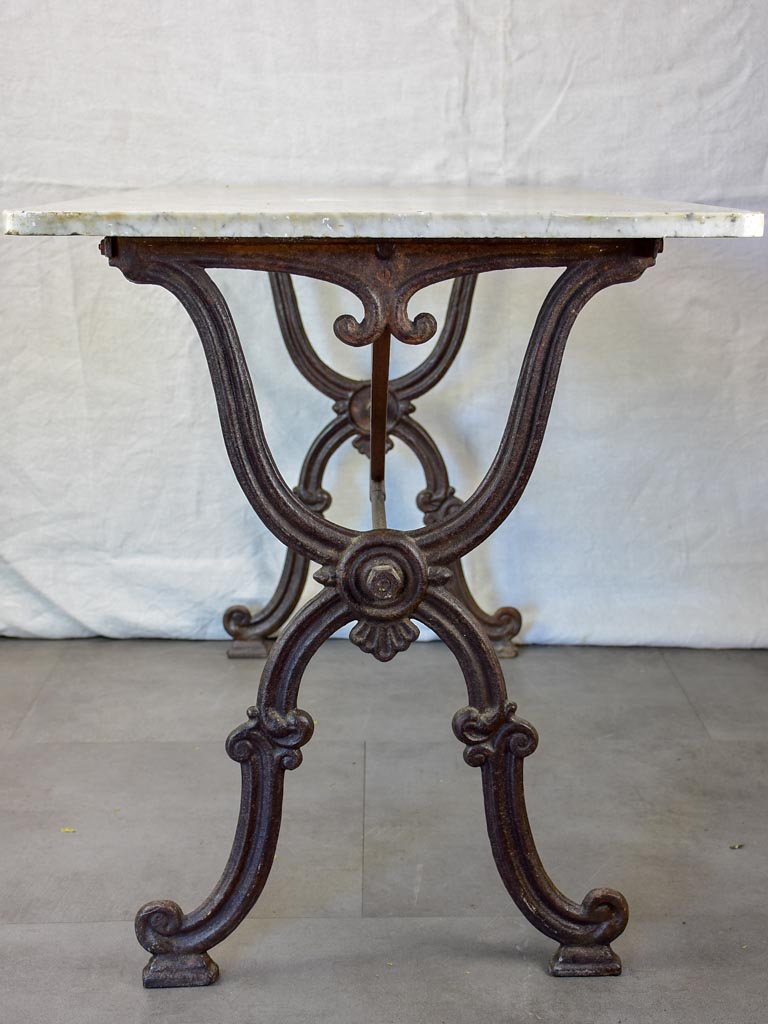 Late nineteenth century French marble presentation table with cast iron base 23¾" x  40½"