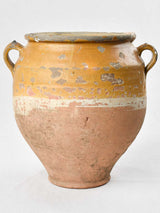 Rustic antiquated French confit pot