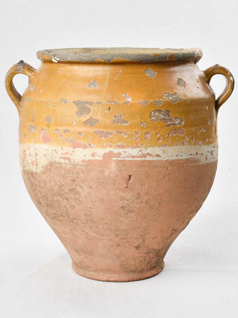 Rustic antiquated French confit pot