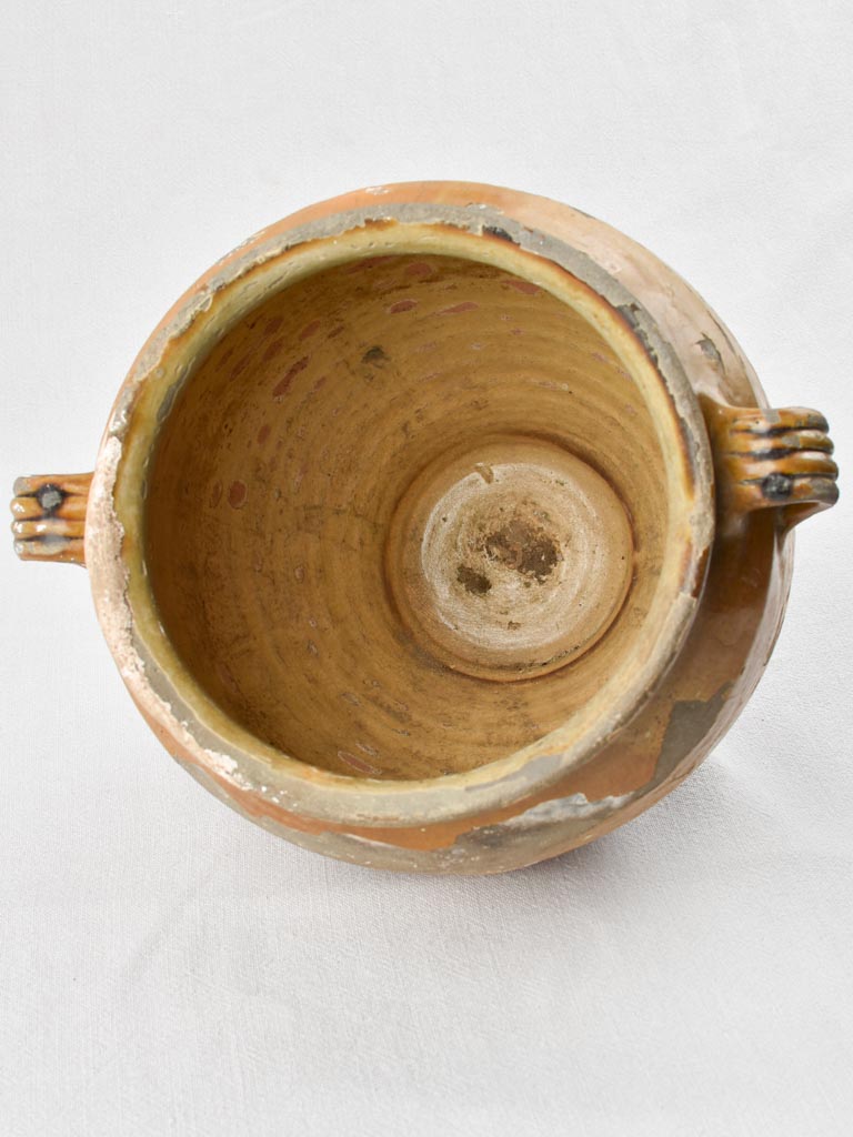 Antiquated confit pot from west France