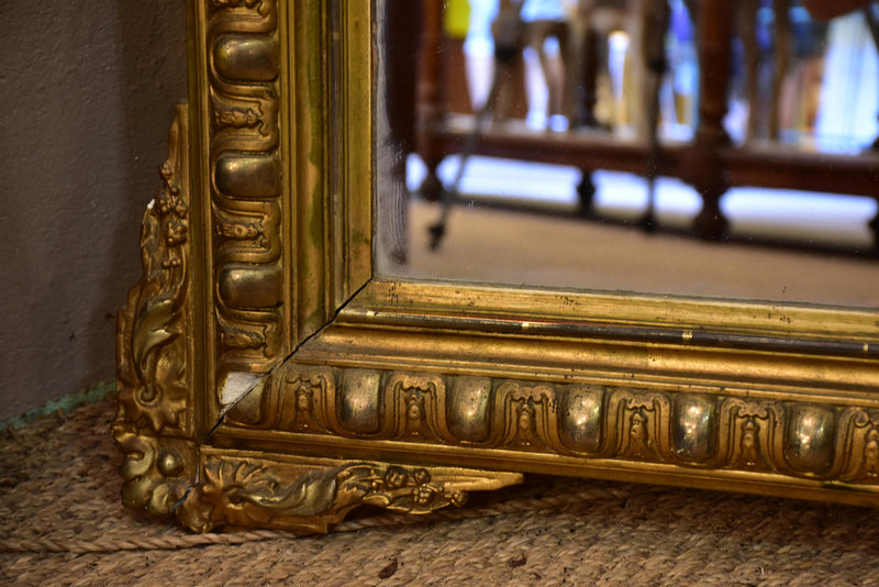 Antique French Regence mirror with gilded frame