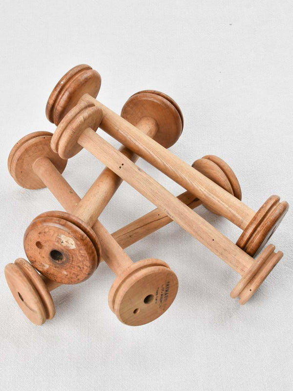 Antique branded wooden bobbins collection
