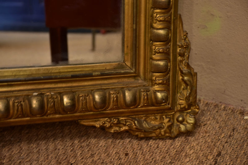 Antique French Regence mirror with gilded frame