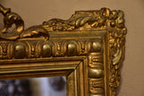 Antique French Regence mirror with gilded frame