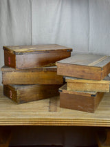 Collection of six large antique wooden boxes from a fabric boutique