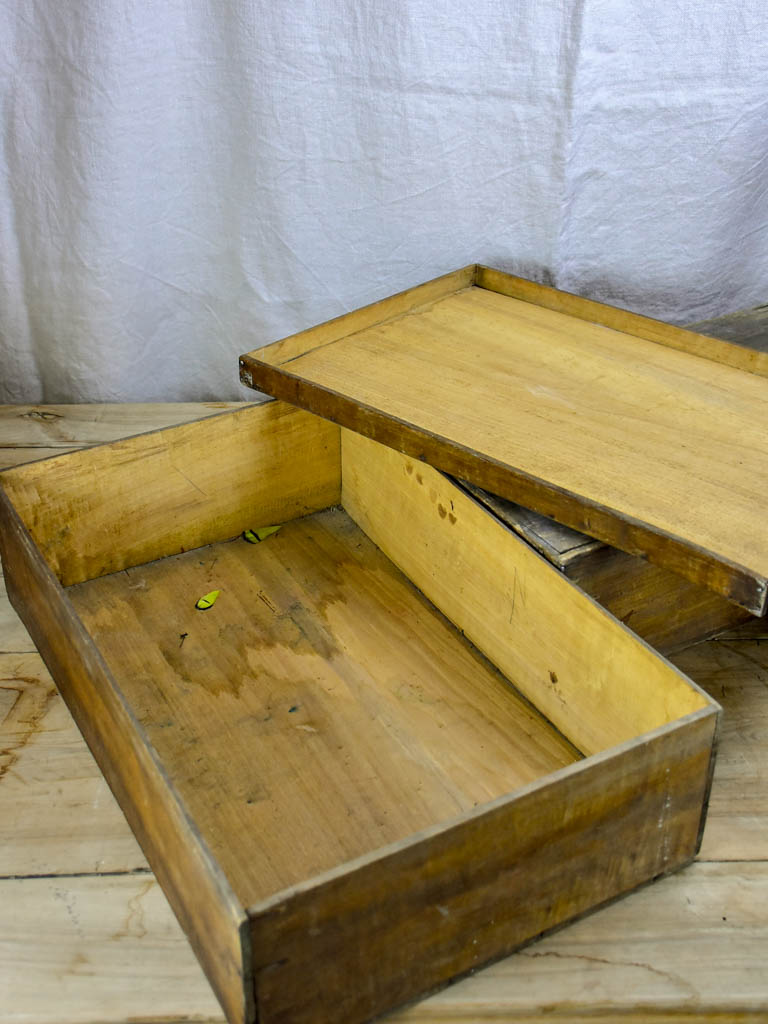 Collection of six large antique wooden boxes from a fabric boutique