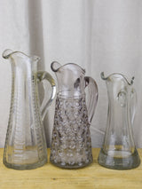 Three antique French pitchers with hand blown glass