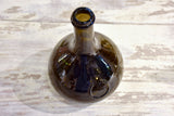 Small antique 'onion' bottle with dark green glass