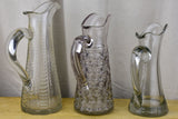 Three antique French pitchers with hand blown glass