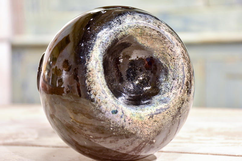 Small antique 'onion' bottle with dark green glass