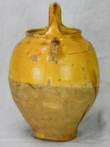Antique French water cruche with yellow glaze