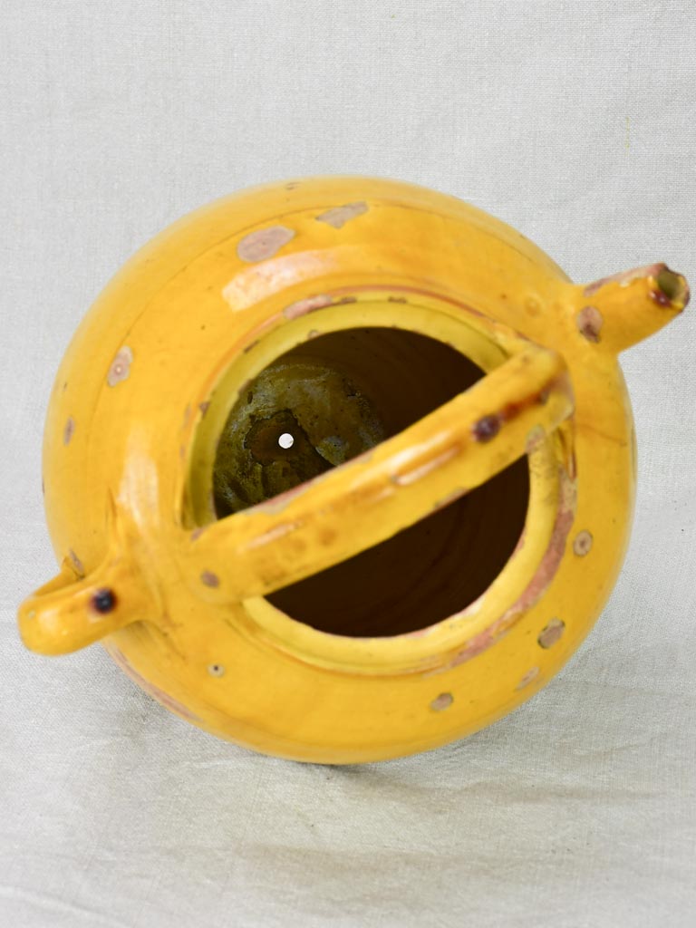 Antique French water cruche with yellow glaze