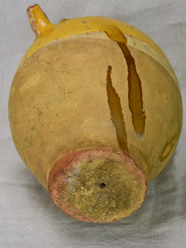 Antique French water cruche with yellow glaze