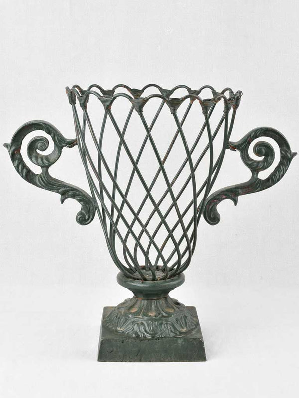 Vintage, cast iron jardiniere with wirework