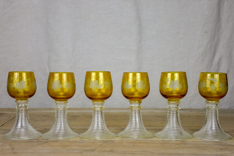 Six white wine glasses from Alsace with engraved decoration and broad ribbed bases
