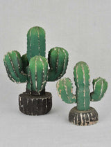 Two vintage wooden cactus decorations
