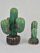 Two vintage wooden cactus decorations