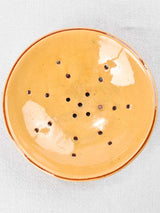 Vintage ocher glazed ceramic strainer plate