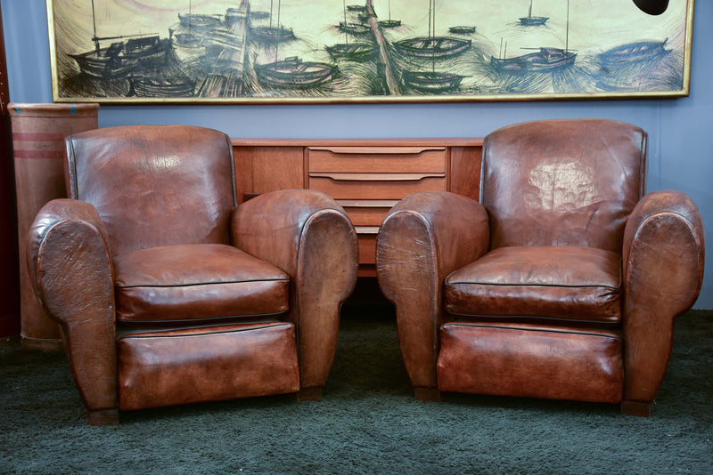 Pair of French leather club chairs with scroll back - pair one