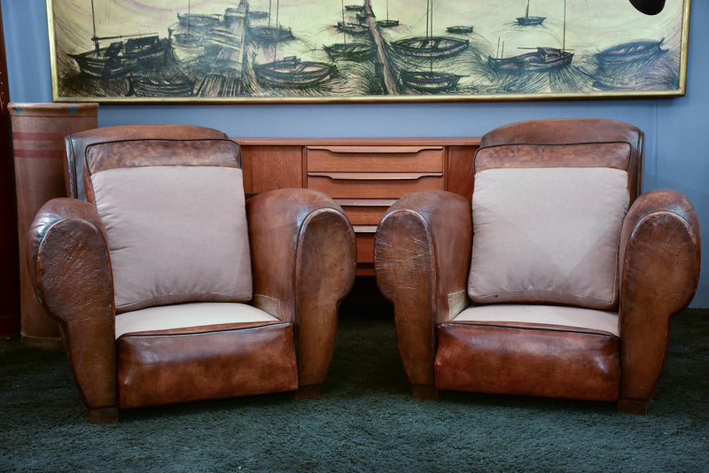Pair of French leather club chairs with scroll back - pair one