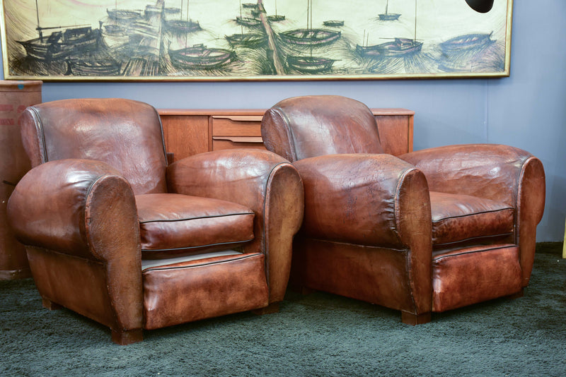Pair of French leather club chairs with scroll back - pair one