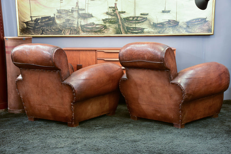 Pair of French leather club chairs with scroll back - pair one