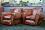 Pair of French leather club chairs with scroll back - pair one
