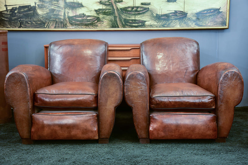 Pair of French leather club chairs with scroll back - pair one