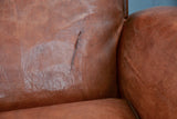 Pair of French leather club chairs with scroll back - pair one