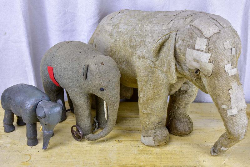 Three antique French toy elephants