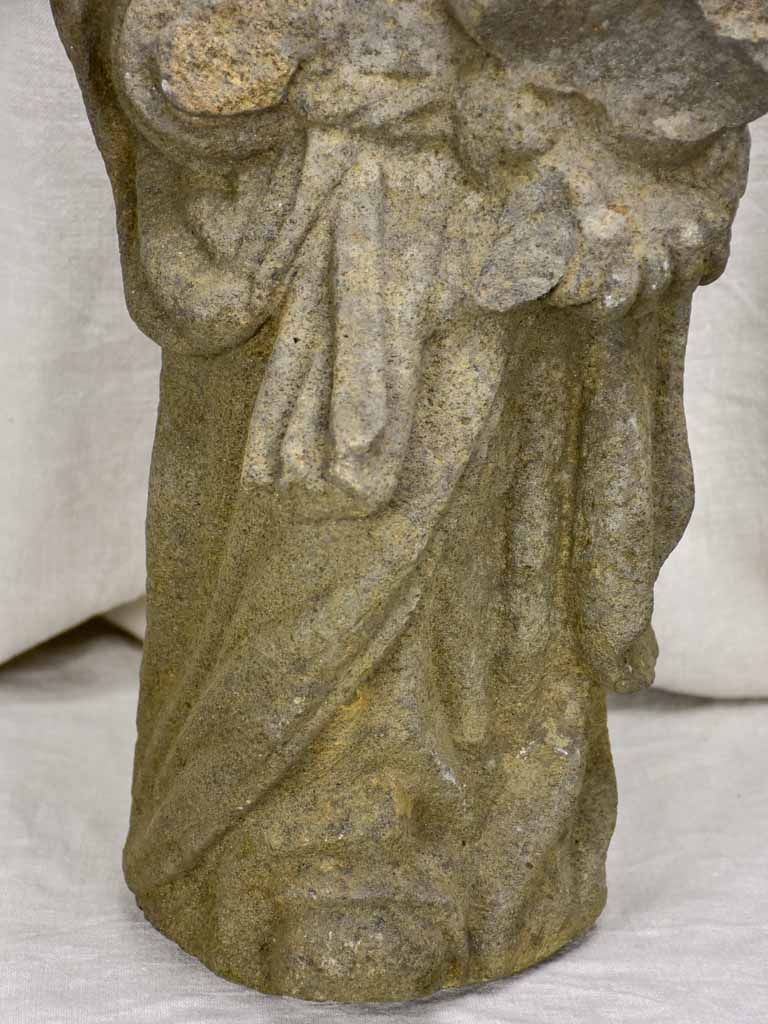 Medieval stone statue of a draped figure from Brittany