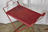 Red industrial French table made from salvaged materials
