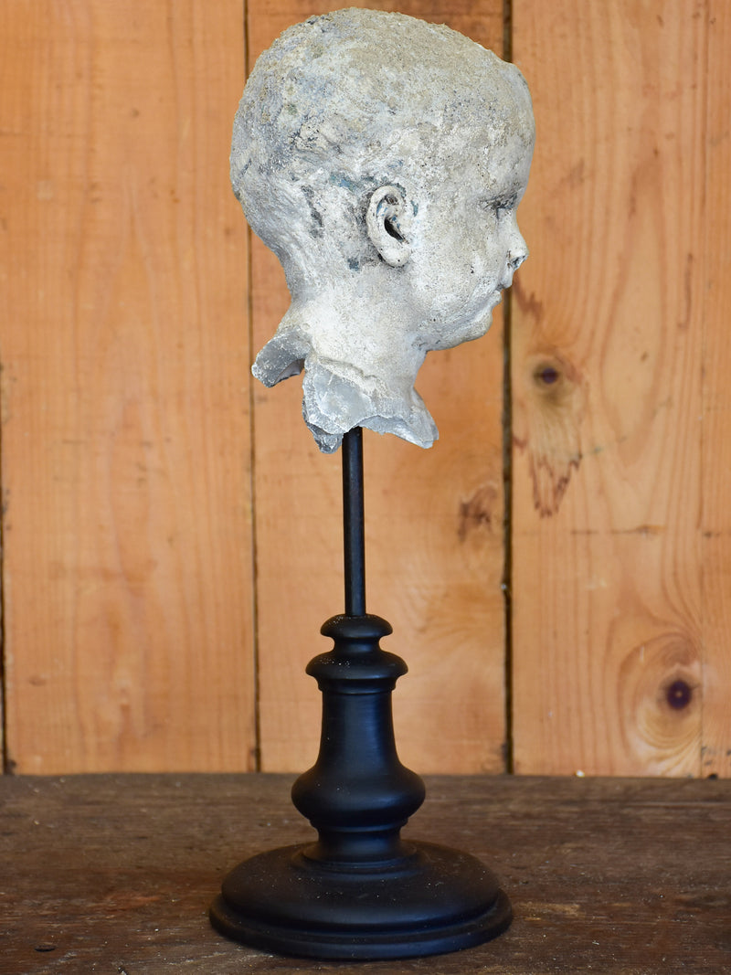 Salvaged mounted antique sculpture