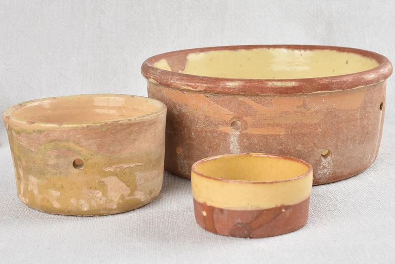 Collection of 21 terracotta cheese strainers 'faisselles'