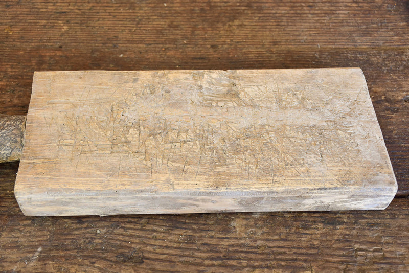 Small antique French cutting board with round handle