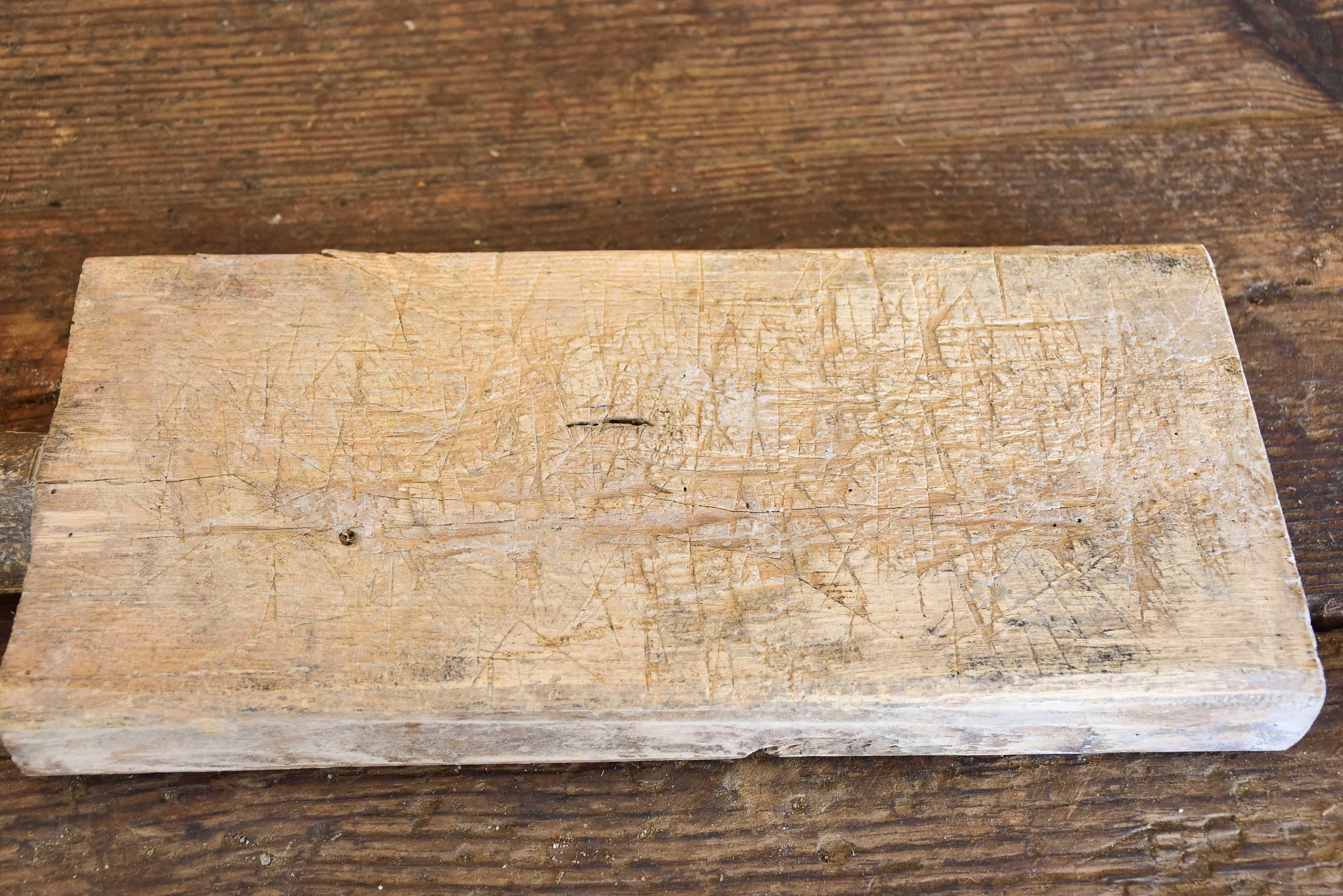 Small antique French cutting board with round handle