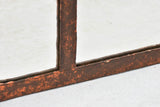 19th century wrought iron framed paneled mirror with red patina 39¾" x 54"