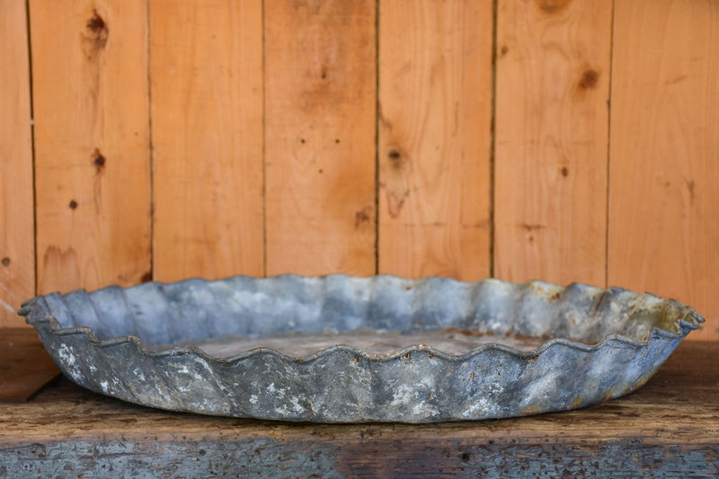 Large antique zinc dish with rippled edge