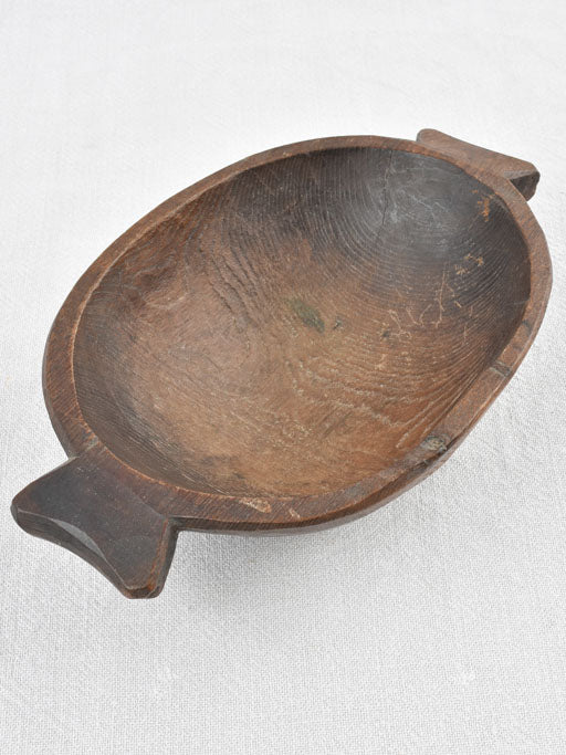 Small primitive wooden bowl w/ fishtail handles 11"