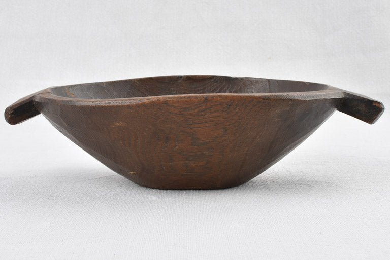 Small primitive wooden bowl w/ fishtail handles 11"