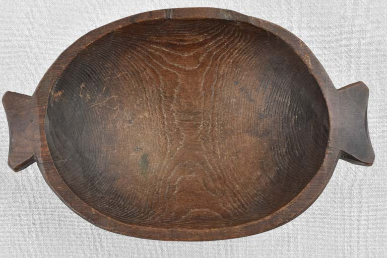Small primitive wooden bowl w/ fishtail handles 11"