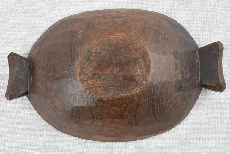 Small primitive wooden bowl w/ fishtail handles 11"
