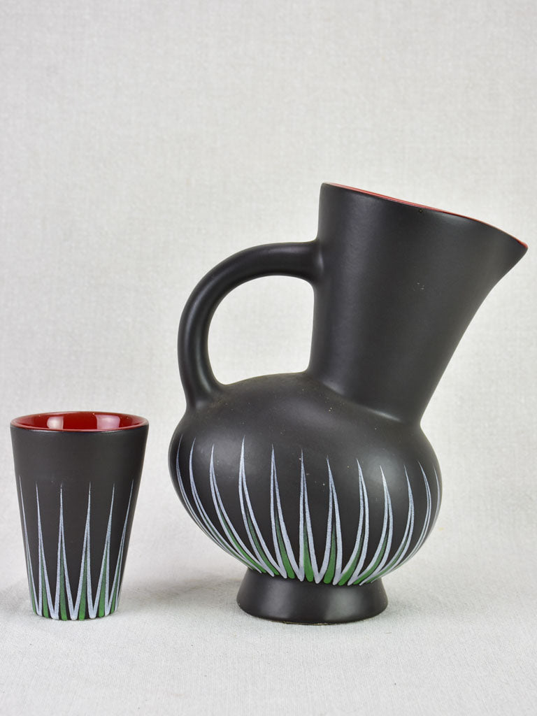 Andre Baud Vallauris set of eight cups and tilted pitcher - black white red and green
