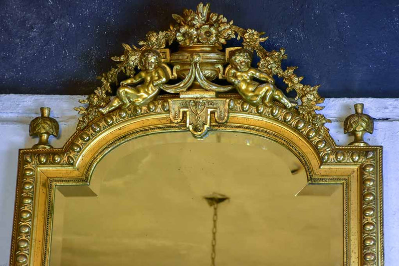 Gilded large Napoleon III mirror with elaborate crest and beveled glass 35½" x 70¾"