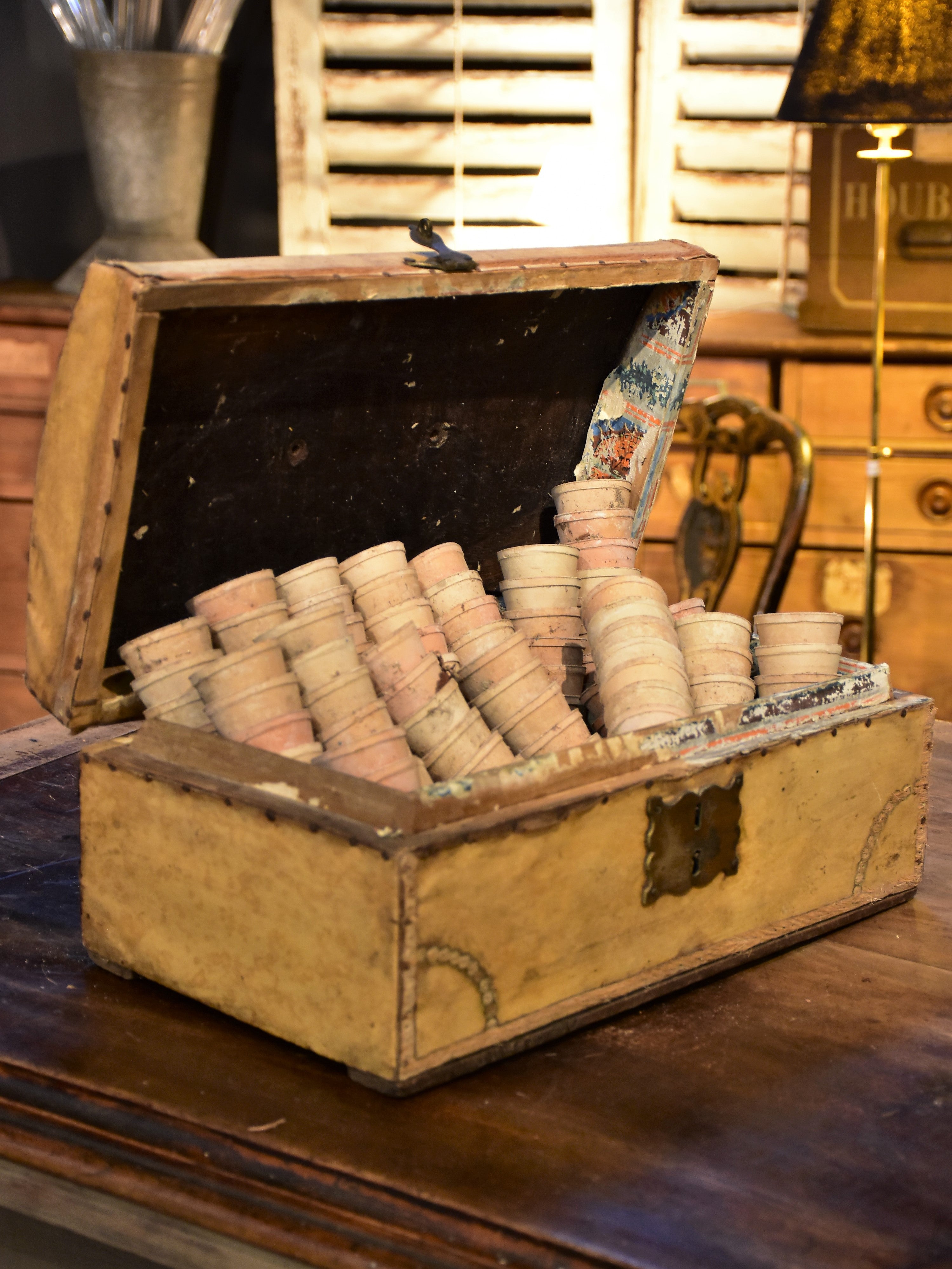 Early 19th century French filing chest with a collection of miniature garden pots