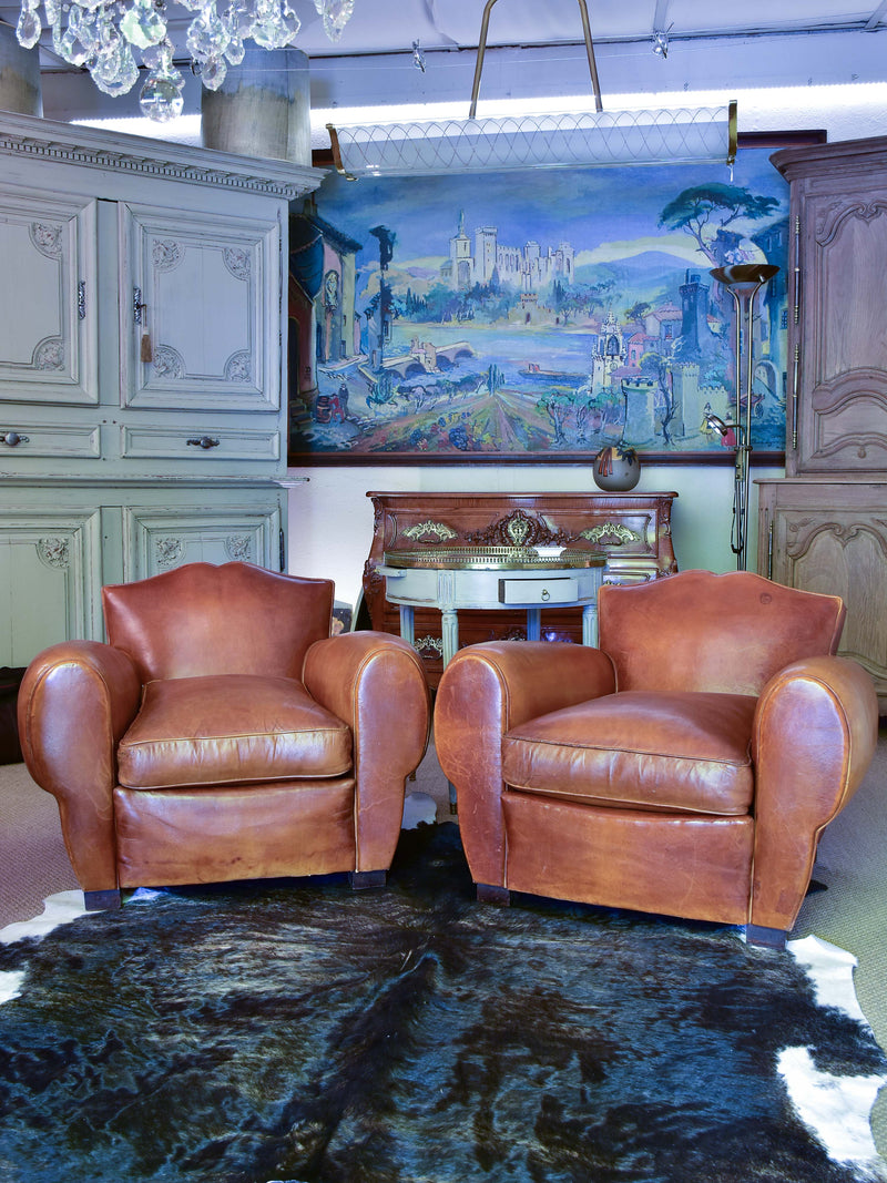 Pair of 1950's moustache back leather club chairs